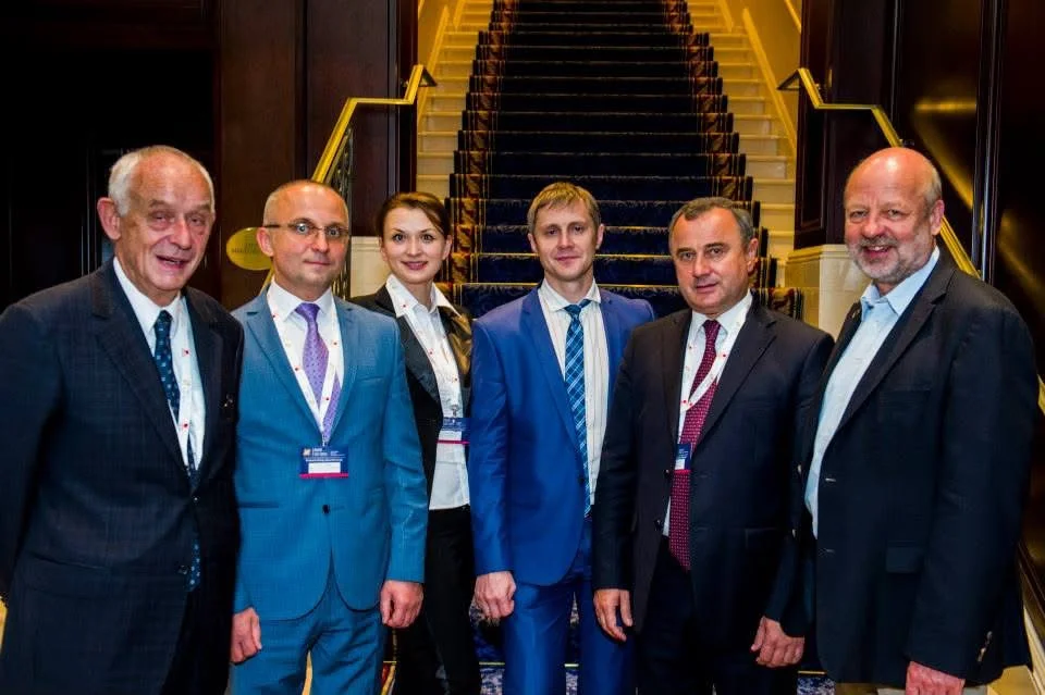 Six speakers and partners of EuroSEF-2014 standing together at the foot of a hotel staircase
